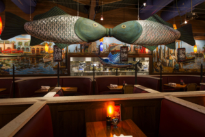 Coastal Flats Fish Sculpture above booth dining room Forrester Construction