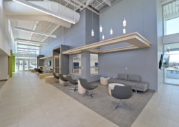 Sterling community center lobby gray wall and chairs high ceiling seating area Forrester Construction