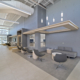 Sterling community center lobby gray wall and chairs high ceiling seating area Forrester Construction