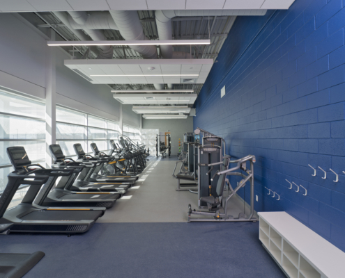 Sterling Community Center fitness center treadmills blue accent wall Forrester Construction