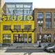 Studio Theatre - Yellow Exterior Studio Sign Street View Forrester Construction