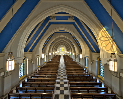 Corpus christi catholic church interior blue vaulted ceilings with church pews Forrester Construction